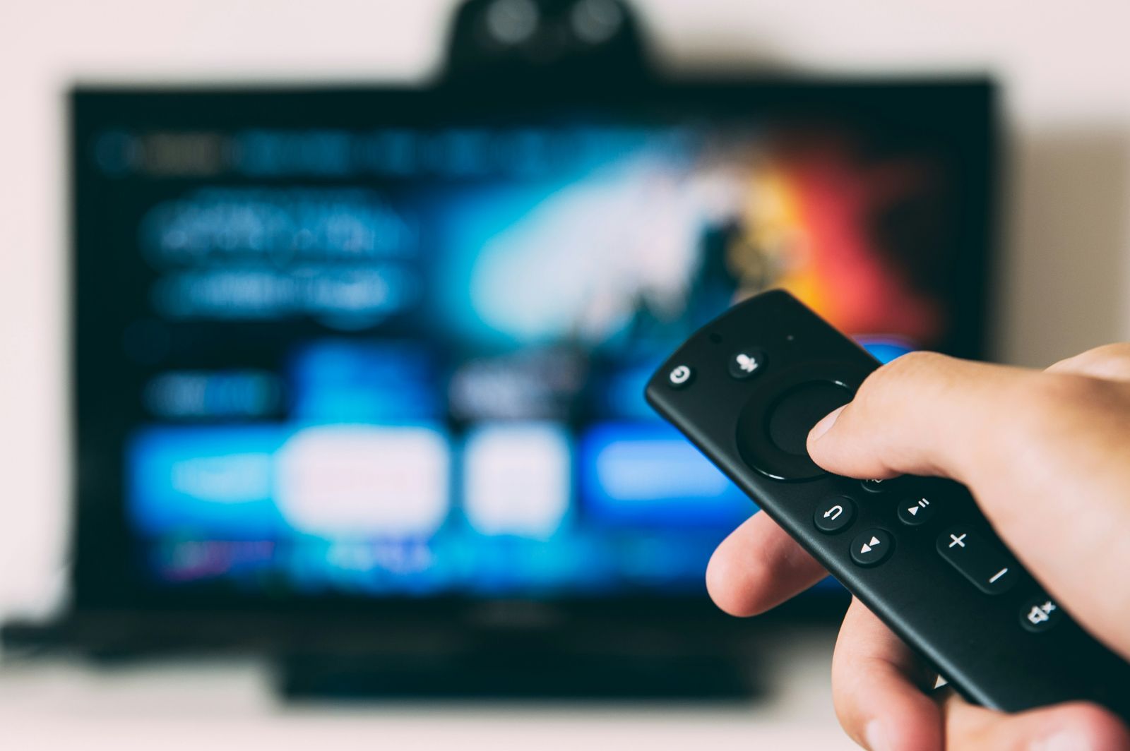 Canadian cord-cutter comparing best IPTV Canada 2026 services with TV remote