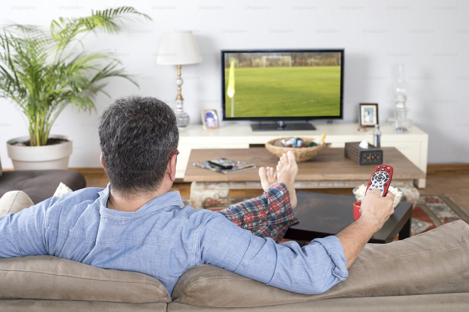 Testing BexyTV IPTV free trial 2026 — remote pointed at 4K TV showing live channels